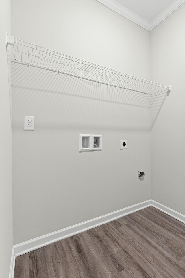 clothes washing area with hardwood / wood-style floors, hookup for a washing machine, ornamental molding, and hookup for an electric dryer