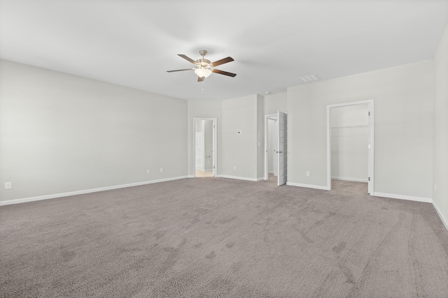 spare room with ceiling fan and carpet floors