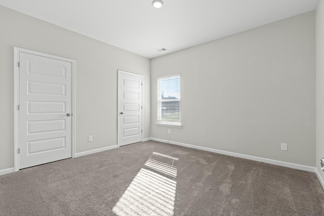 unfurnished bedroom with carpet flooring