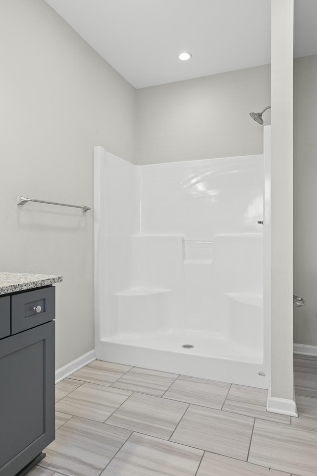 bathroom with vanity and walk in shower