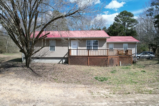 ranch-style home with metal roof and crawl space