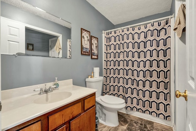 full bath featuring toilet, curtained shower, a textured ceiling, and vanity