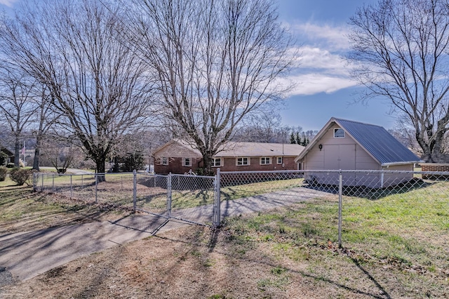 view of front facade with a fenced front yard, a gate, and a front lawn