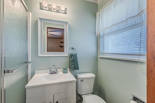 full bathroom with toilet, a shower with door, and vanity