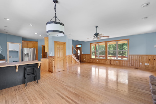 7105 Toestring Valley Rd, Spring City, TN 37381 - unfurnished living room featuring a wainscoted wall, light wood-type flooring, wooden walls, a ceiling fan, and recessed lighting