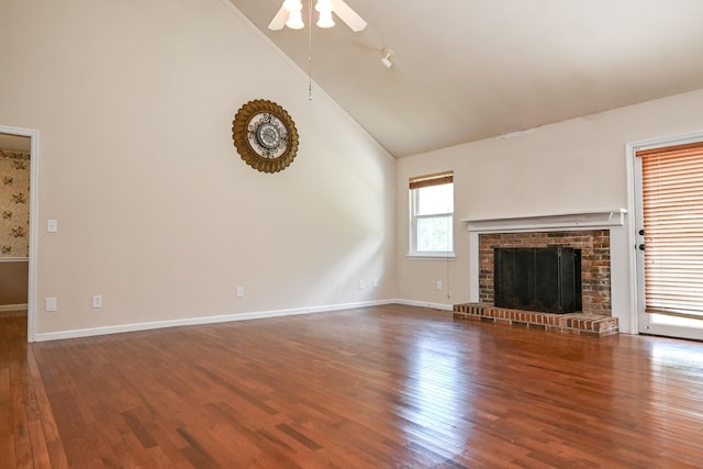 unfurnished living room featuring ceiling fan, high vaulted ceiling, hardwood / wood-style floors, and a fireplace