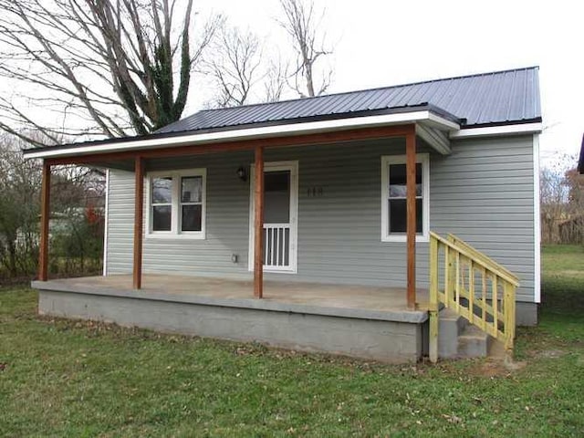 back of property with covered porch