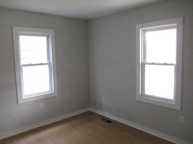 unfurnished room with plenty of natural light and light wood-type flooring