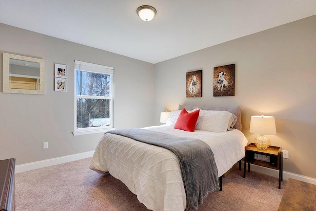 bedroom with carpet floors and baseboards