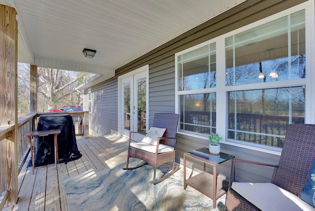 wooden deck featuring french doors