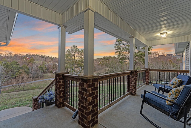 deck at dusk with covered porch