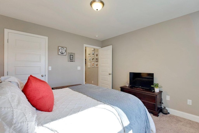 bedroom featuring light colored carpet