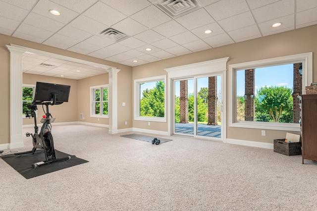 exercise area with a paneled ceiling and carpet floors