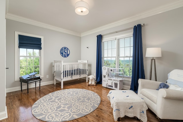 bedroom featuring multiple windows, dark hardwood / wood-style floors, and ornamental molding