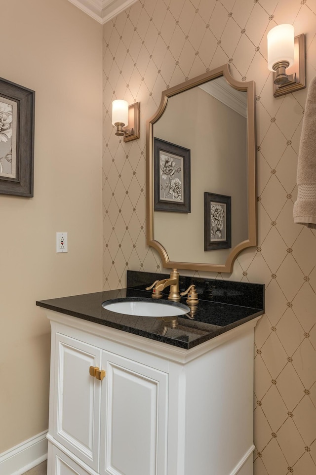 bathroom with vanity and ornamental molding