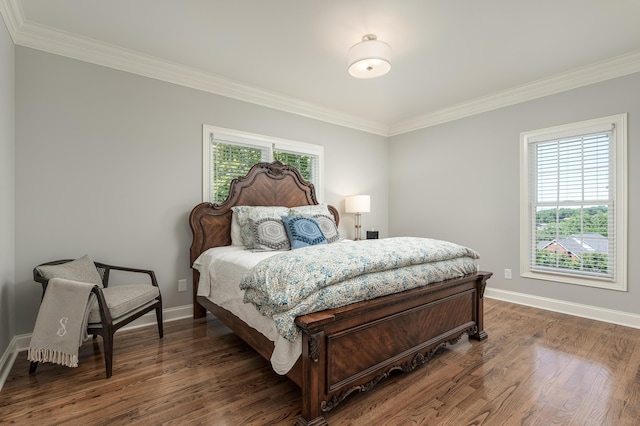 bedroom with dark hardwood / wood-style flooring and ornamental molding