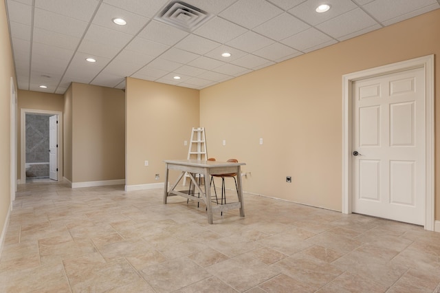 interior space featuring a drop ceiling