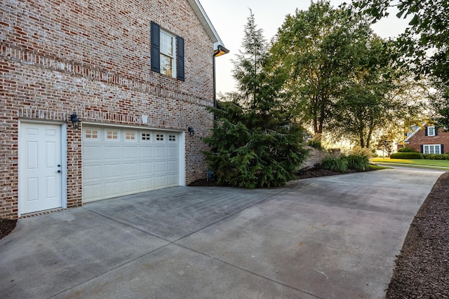 view of side of property featuring a garage