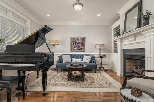 interior space featuring crown molding, built in features, and hardwood / wood-style floors