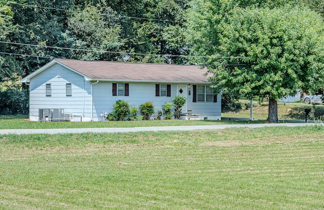 ranch-style home featuring a front lawn