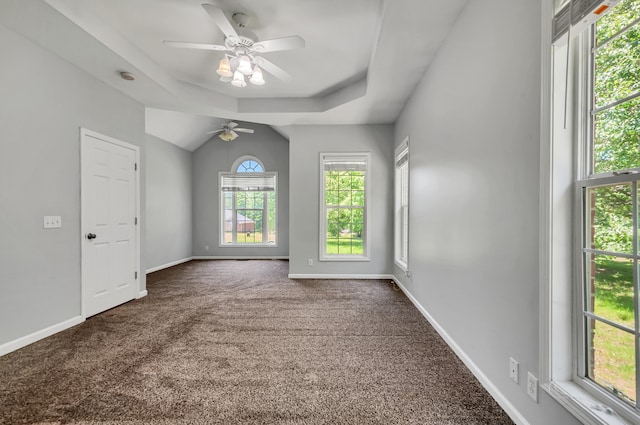 1031 Laurel Hill Dr, Dickson, TN 37055 - spare room featuring dark colored carpet, a ceiling fan, baseboards, and a tray ceiling