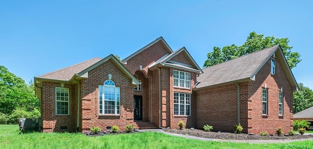 1031 Laurel Hill Dr, Dickson, TN 37055 - view of front facade featuring brick siding, roof with shingles, crawl space, and a front lawn