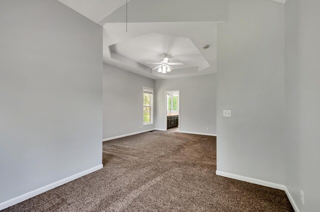 1031 Laurel Hill Dr, Dickson, TN 37055 - carpeted empty room with baseboards, ceiling fan, and a tray ceiling
