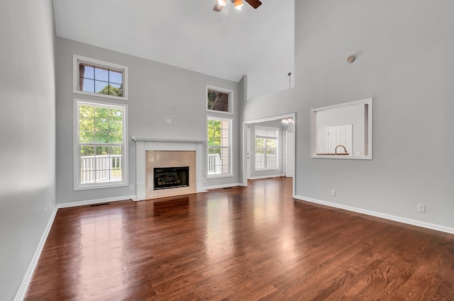 1031 Laurel Hill Dr, Dickson, TN 37055 - unfurnished living room featuring high vaulted ceiling, a ceiling fan, baseboards, and wood finished floors