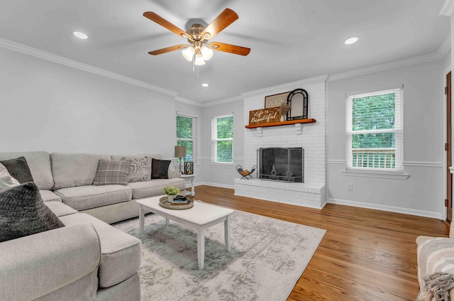 6833 Buck Trail Dr, Harrison, TN 37341 - living area featuring a ceiling fan, wood finished floors, a brick fireplace, recessed lighting, and baseboards