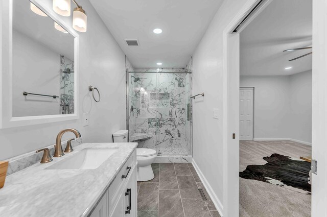 6833 Buck Trail Dr, Harrison, TN 37341 - bathroom with a marble finish shower, vanity, toilet, recessed lighting, and baseboards