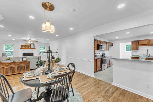 6833 Buck Trail Dr, Harrison, TN 37341 - dining area with healthy amount of natural light, recessed lighting, ceiling fan, ornamental molding, and light wood-style flooring