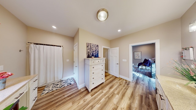 bathroom with hardwood / wood-style floors