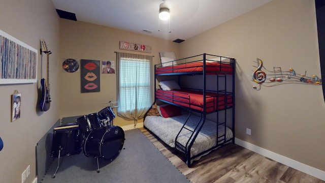 bedroom with hardwood / wood-style flooring and ceiling fan