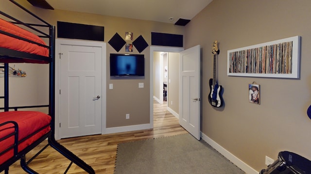 bedroom featuring hardwood / wood-style floors