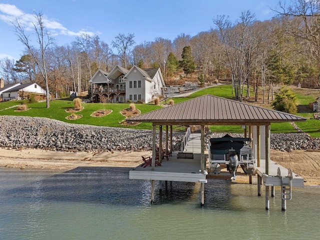 view of dock featuring a water view and a lawn