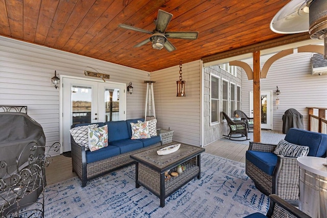 view of patio / terrace featuring french doors, ceiling fan, and an outdoor living space