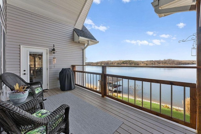 wooden deck with a water view