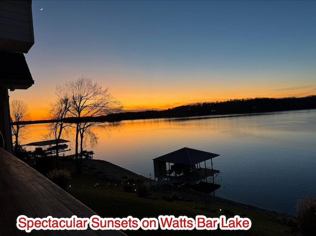 view of dock featuring a gazebo and a water view