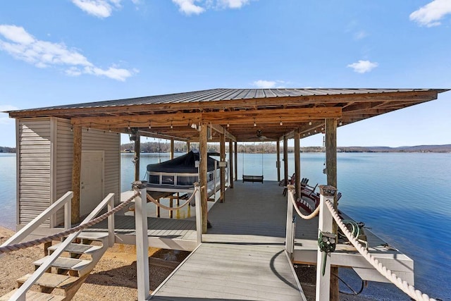 dock area with a water view