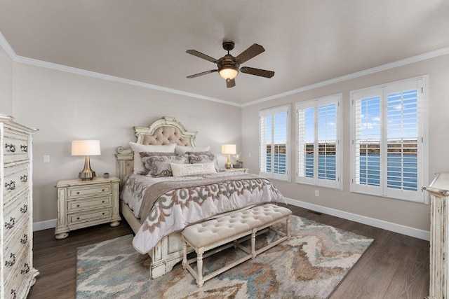 bedroom featuring multiple windows, crown molding, dark wood-type flooring, and ceiling fan