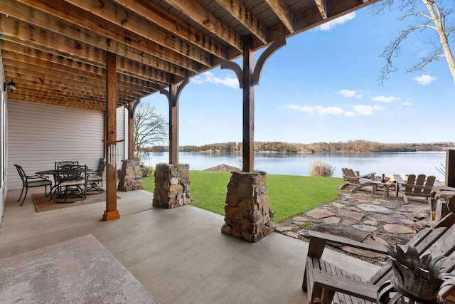 view of patio with a water view