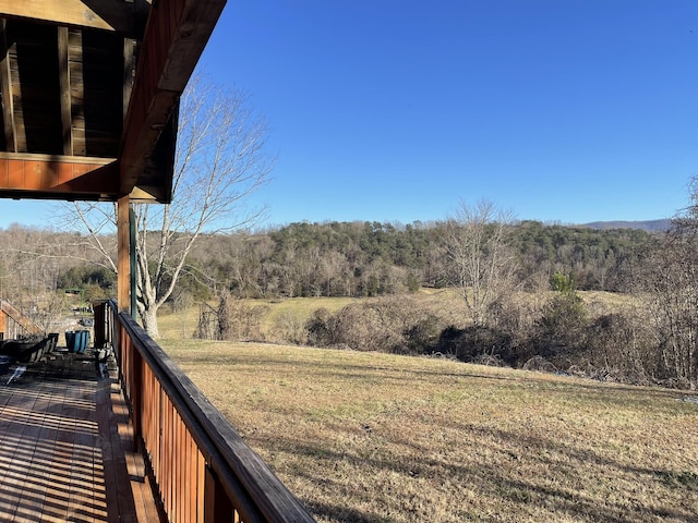 deck featuring a lawn