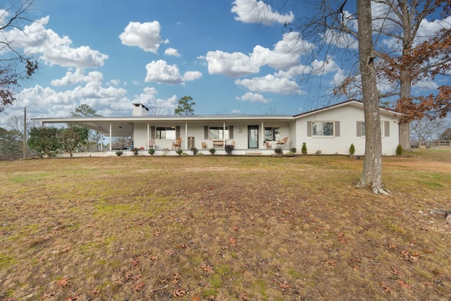 single story home featuring covered porch, a carport, and a front yard