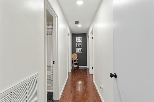 hall with dark wood-type flooring