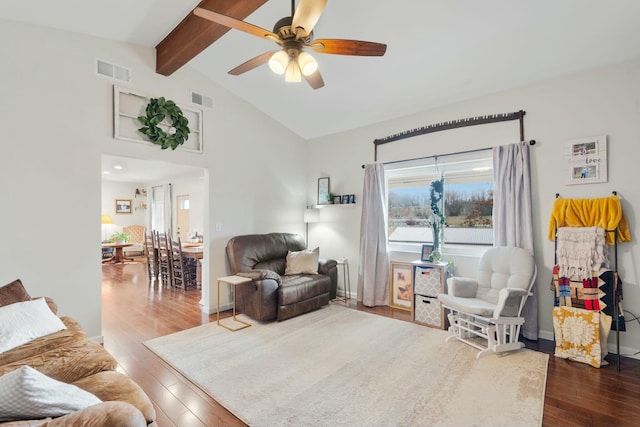 living room with hardwood / wood-style flooring, lofted ceiling with beams, and ceiling fan