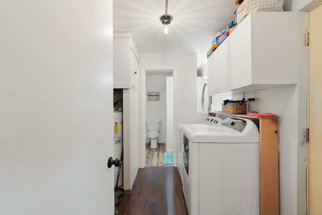 laundry area with independent washer and dryer, dark hardwood / wood-style flooring, and gas water heater