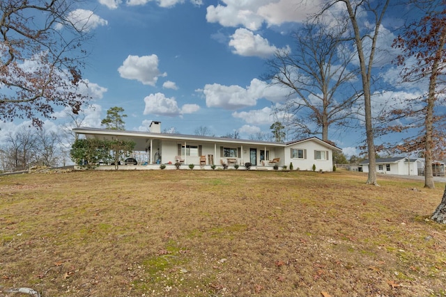 single story home featuring a porch and a front yard