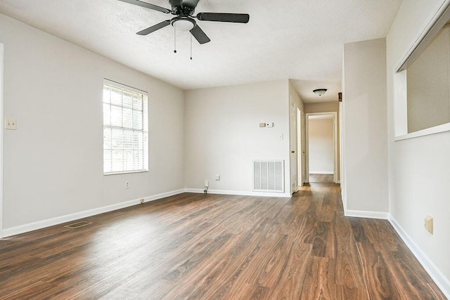 1132 Eldredge Cir NW, Cleveland, TN 37312 - spare room featuring dark wood-style flooring, a ceiling fan, baseboards, and a textured ceiling