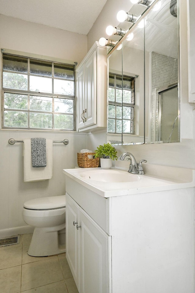 1132 Eldredge Cir NW, Cleveland, TN 37312 - bathroom with vanity, toilet, tile patterned floors, and a shower with shower door