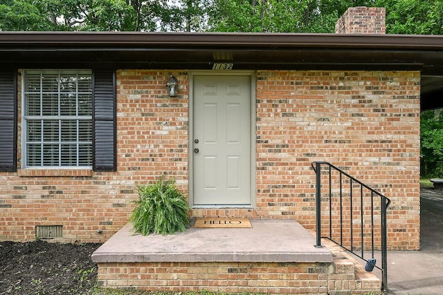 1132 Eldredge Cir NW, Cleveland, TN 37312 - doorway to property with brick siding, crawl space, and a chimney
